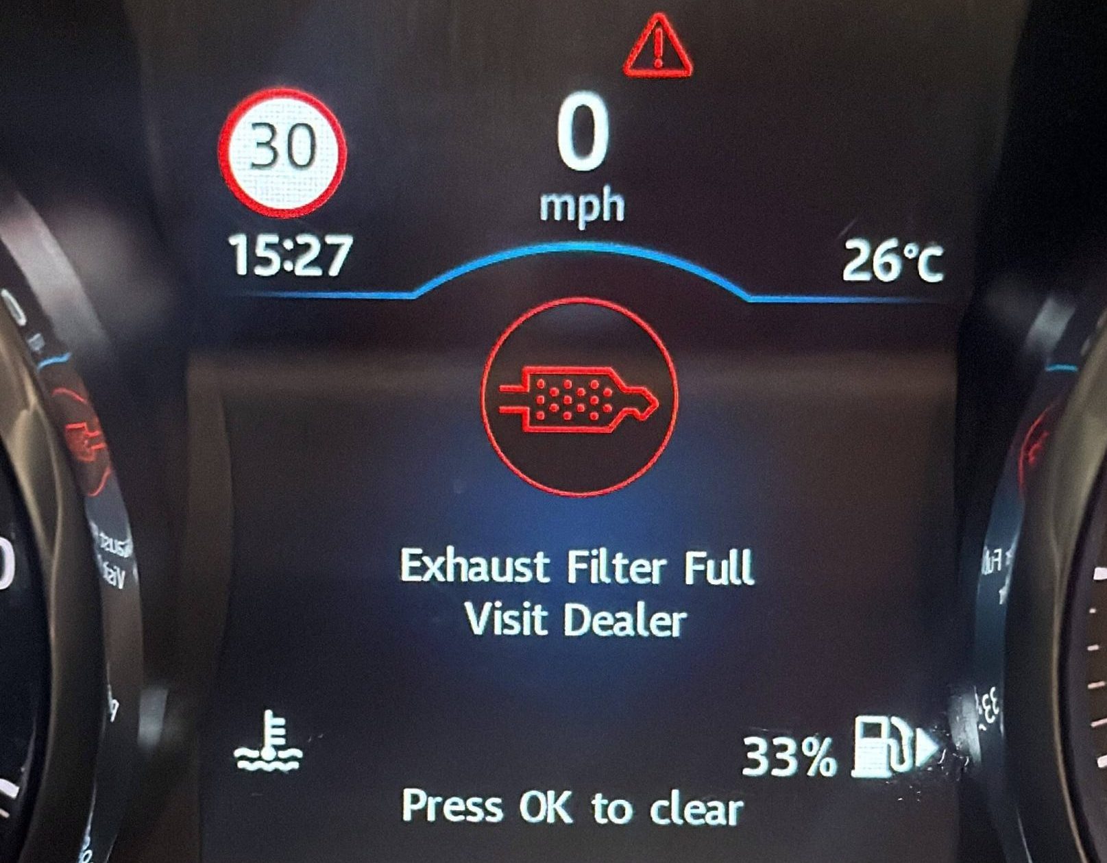 Dashboard displaying an Exhaust Filter Full warning on a diesel vehicle